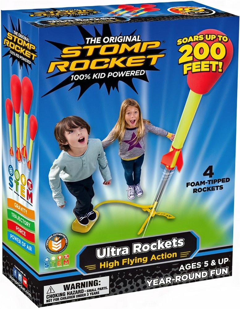 Kids playing with space-themed outdoor toy set in a sunny backyard.
